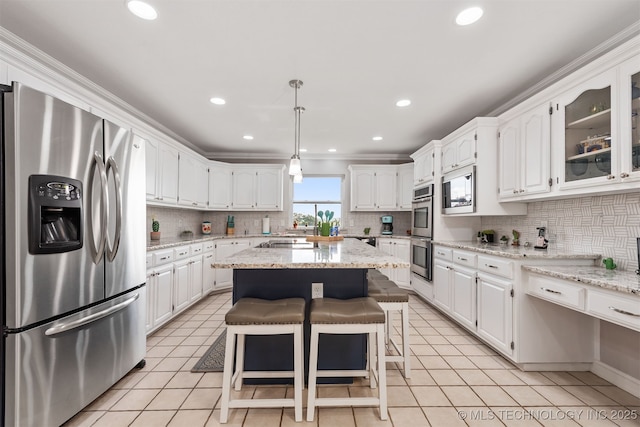 33922 S 4240th Rd, Inola, OK 74036 - kitchen with stainless steel appliances, white cabinets, tasteful backsplash, light tile patterned flooring, and recessed lighting