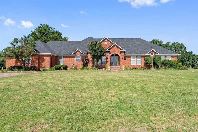 33922 S 4240th Rd, Inola, OK 74036 - view of front of house featuring brick siding and a front lawn