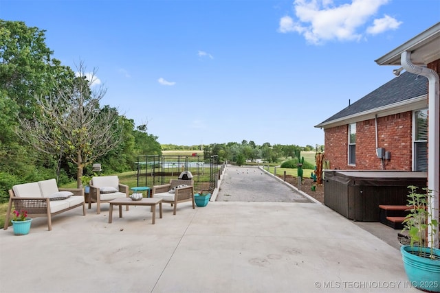 33922 S 4240th Rd, Inola, OK 74036 - view of patio with a hot tub and an outdoor living space