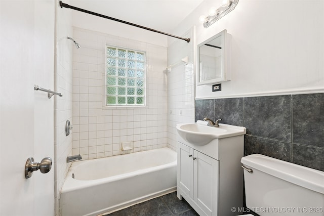 1422 E 52nd St, Tulsa, OK 74105 - full bath with tile walls, vanity, and shower / washtub combination