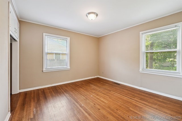 1422 E 52nd St, Tulsa, OK 74105 - unfurnished room with hardwood / wood-style floors and crown molding