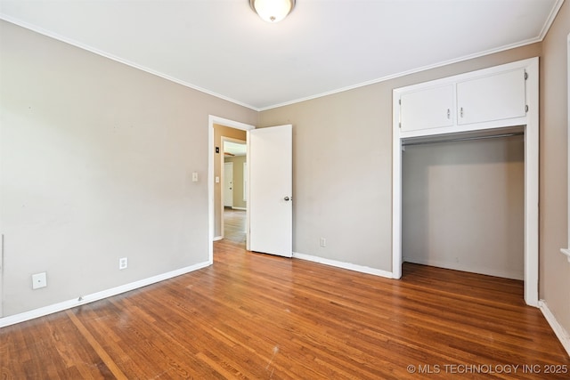 1422 E 52nd St, Tulsa, OK 74105 - unfurnished bedroom featuring wood finished floors, ornamental molding, and a closet