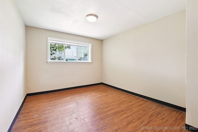 1422 E 52nd St, Tulsa, OK 74105 - spare room featuring wood finished floors