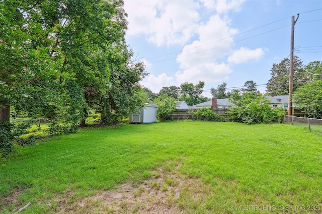 1422 E 52nd St, Tulsa, OK 74105 - fenced backyard with a storage shed