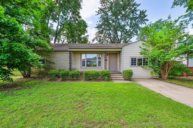 1422 E 52nd St, Tulsa, OK 74105 - view of front facade featuring a front lawn, brick siding, and driveway