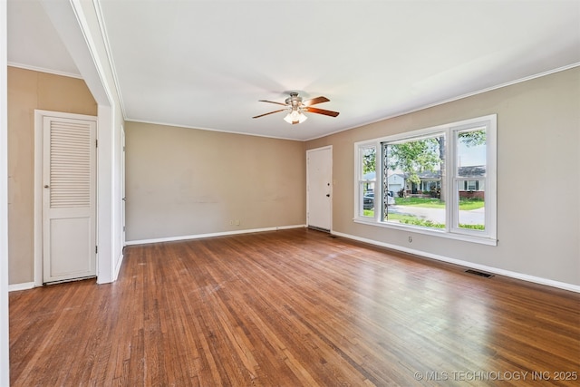 1422 E 52nd St, Tulsa, OK 74105 - spare room featuring ceiling fan, wood finished floors, and ornamental molding