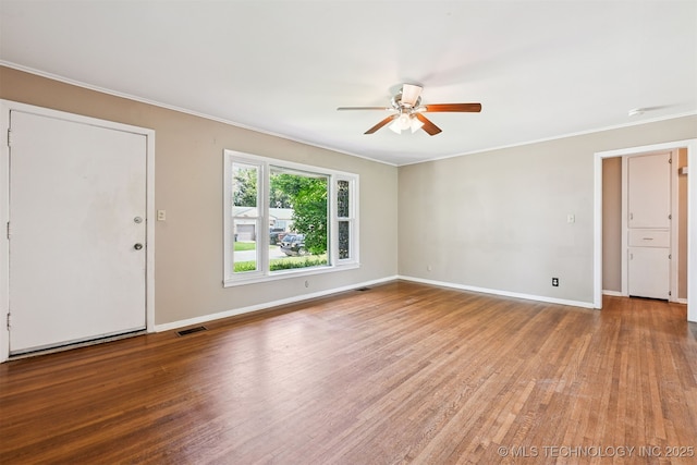 1422 E 52nd St, Tulsa, OK 74105 - unfurnished room featuring ceiling fan, ornamental molding, and wood finished floors