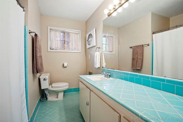 3926 E 51st Pl, Tulsa, OK 74135 - bathroom featuring baseboards and vanity