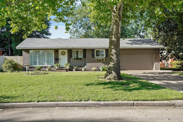 3926 E 51st Pl, Tulsa, OK 74135 - ranch-style home with brick siding, an attached garage, and concrete driveway