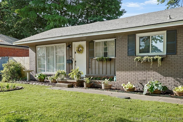 3926 E 51st Pl, Tulsa, OK 74135 - ranch-style house featuring brick siding, a front lawn, and a shingled roof