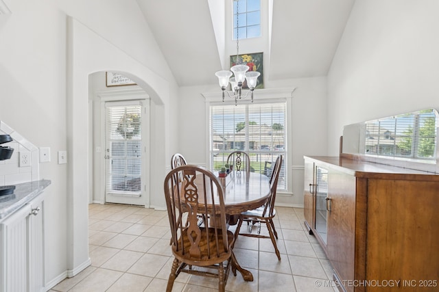 1014 W 120th St S, Jenks, OK 74037 - dining room with a chandelier, light tile patterned floors, arched walkways, and high vaulted ceiling