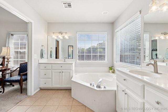 1014 W 120th St S, Jenks, OK 74037 - full bath with two vanities, a garden tub, and tile patterned floors