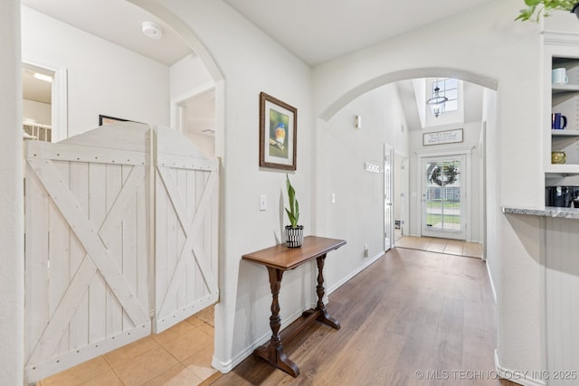 1014 W 120th St S, Jenks, OK 74037 - foyer with arched walkways and wood finished floors