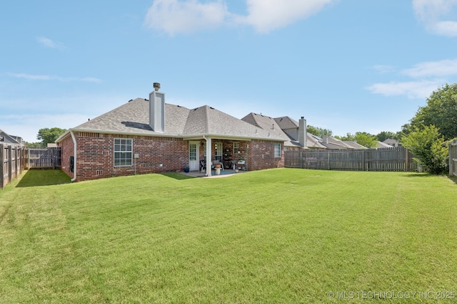 1014 W 120th St S, Jenks, OK 74037 - back of property with brick siding, a fenced backyard, a patio area, a chimney, and roof with shingles