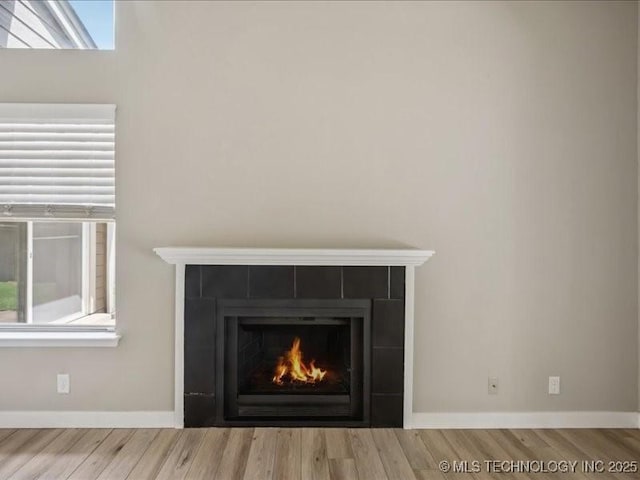 9118 S Florence Ave Unit 9118, Tulsa, OK 74137 - detailed view of a fireplace and wood finished floors
