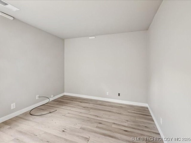 9118 S Florence Ave Unit 9118, Tulsa, OK 74137 - unfurnished room featuring wood finished floors and baseboards