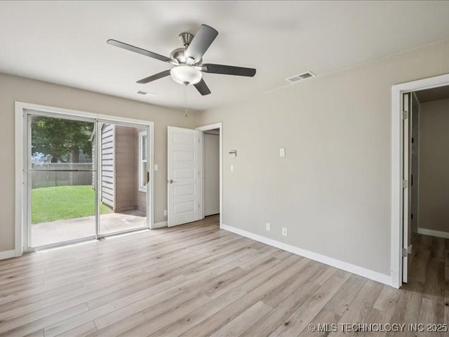 9118 S Florence Ave Unit 9118, Tulsa, OK 74137 - unfurnished bedroom featuring access to outside, light wood finished floors, and a ceiling fan