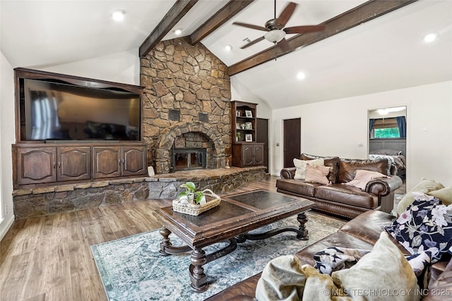 18251 145th W Ave, Sapulpa, OK 74066 - living area featuring wood finished floors, ceiling fan, and a stone fireplace