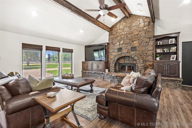 18251 145th W Ave, Sapulpa, OK 74066 - living room with a ceiling fan, wood finished floors, and a stone fireplace