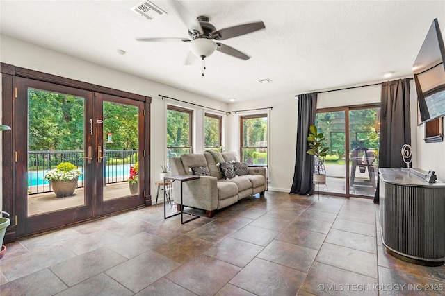 18251 145th W Ave, Sapulpa, OK 74066 - living room featuring french doors, plenty of natural light, and ceiling fan