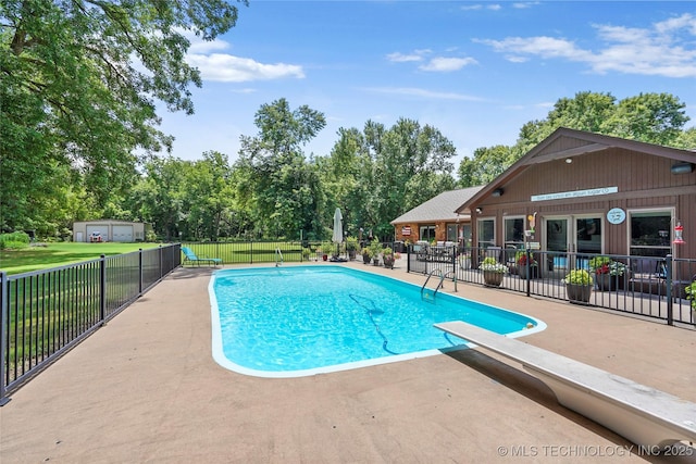 18251 145th W Ave, Sapulpa, OK 74066 - view of pool with a patio area, a diving board, and view of wooded area