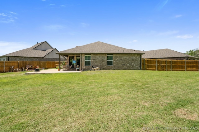 7245 E 154th St S, Bixby, OK 74008 - rear view of property featuring a patio area, a fenced backyard, and brick siding