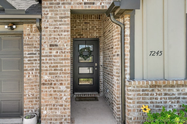 7245 E 154th St S, Bixby, OK 74008 - doorway to property featuring brick siding