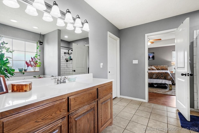 545 E 498th Cir, Pryor, OK 74361 - ensuite bathroom featuring vanity, plenty of natural light, tile patterned floors, and a ceiling fan