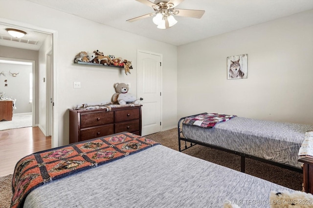 545 E 498th Cir, Pryor, OK 74361 - bedroom with ceiling fan and wood finished floors