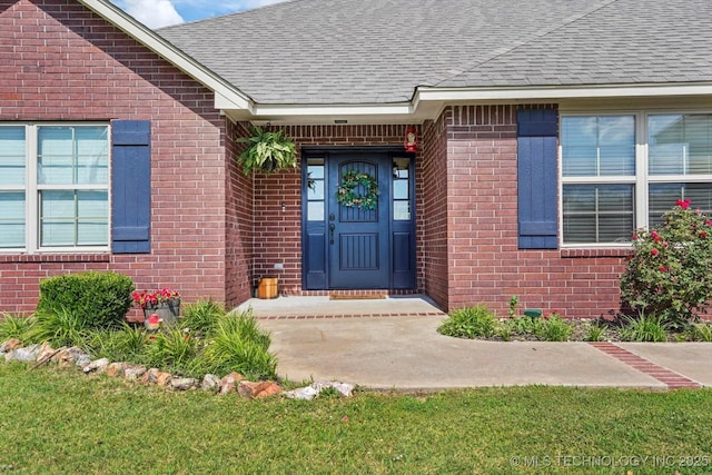 545 E 498th Cir, Pryor, OK 74361 - view of exterior entry featuring roof with shingles and brick siding