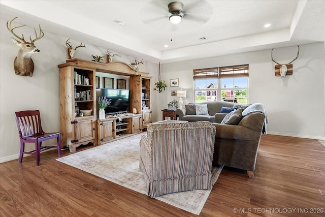 545 E 498th Cir, Pryor, OK 74361 - living area featuring a tray ceiling, wood finished floors, ceiling fan, and recessed lighting
