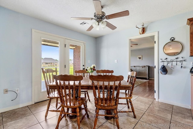 545 E 498th Cir, Pryor, OK 74361 - dining space featuring ceiling fan, light tile patterned floors, and a textured ceiling