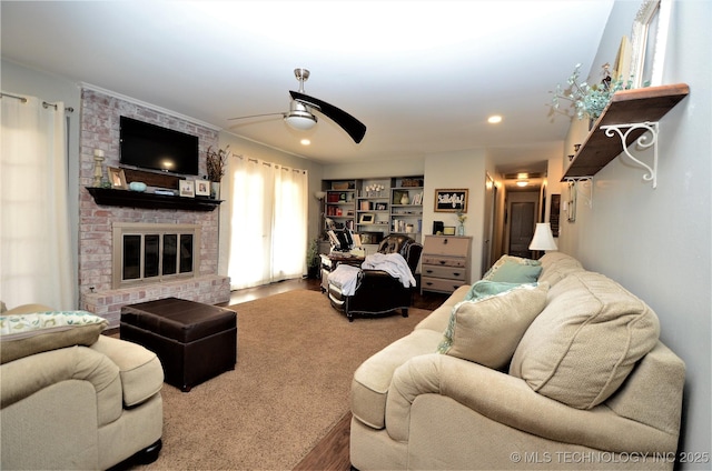 236 W 7th Ave, Bristow, OK 74010 - living room featuring a ceiling fan, a brick fireplace, wood finished floors, and recessed lighting