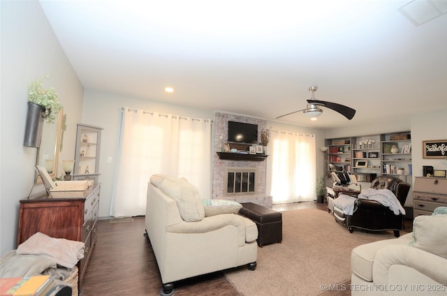 236 W 7th Ave, Bristow, OK 74010 - living area featuring a ceiling fan, a brick fireplace, recessed lighting, and dark wood-style flooring