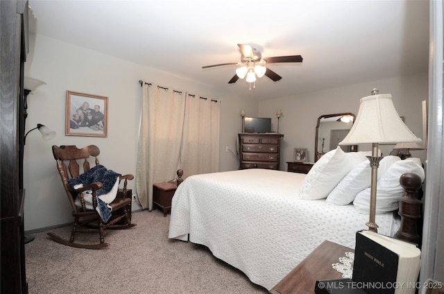 236 W 7th Ave, Bristow, OK 74010 - bedroom with light carpet and a ceiling fan