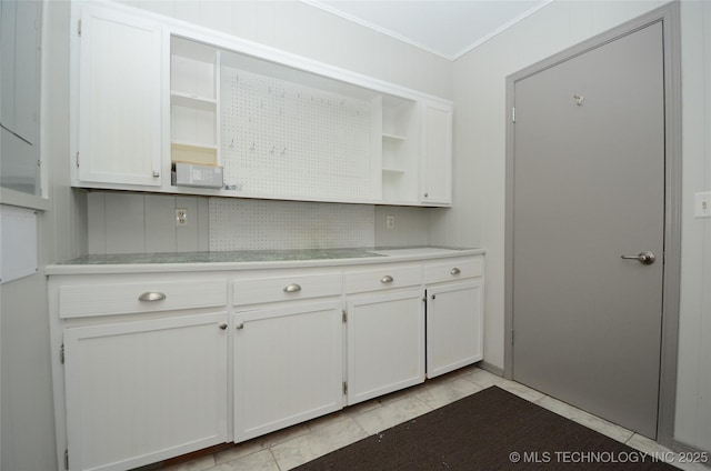 236 W 7th Ave, Bristow, OK 74010 - kitchen featuring open shelves, light countertops, crown molding, and white cabinets