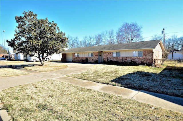 236 W 7th Ave, Bristow, OK 74010 - ranch-style home featuring brick siding, concrete driveway, a front yard, and a garage