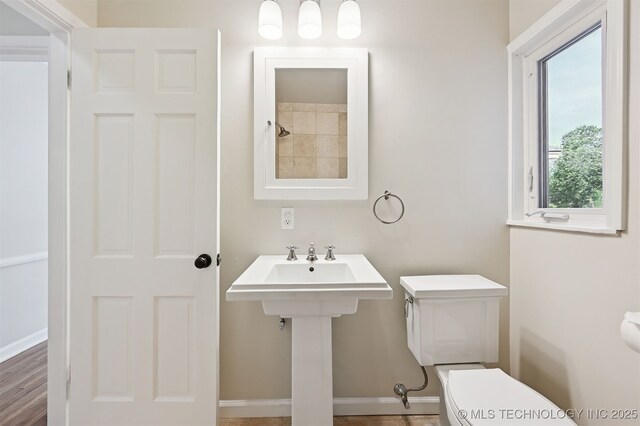 2811 E 22nd St, Tulsa, OK 74114 - bathroom with toilet and baseboards
