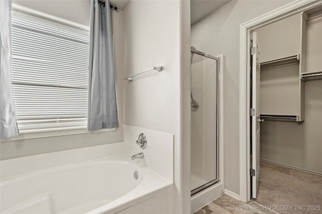 5612 N 31st St, Broken Arrow, OK 74014 - full bathroom featuring a bath, a shower stall, and a spacious closet