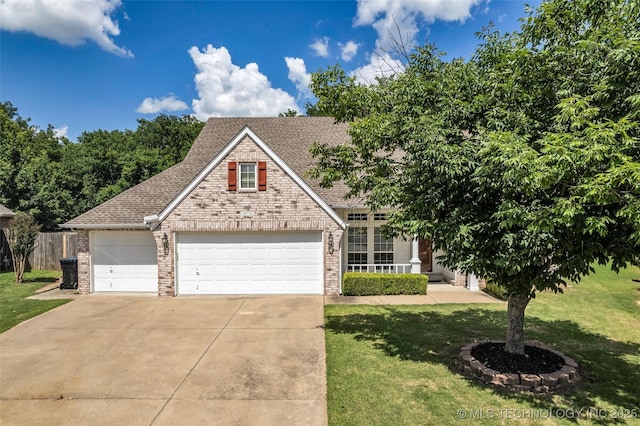 19722 E 50th Ct S, Broken Arrow, OK 74014 - view of front facade with brick siding, roof with shingles, a front lawn, driveway, and a garage