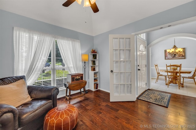19722 E 50th Ct S, Broken Arrow, OK 74014 - living area featuring a chandelier, hardwood / wood-style flooring, a ceiling fan, high vaulted ceiling, and arched walkways