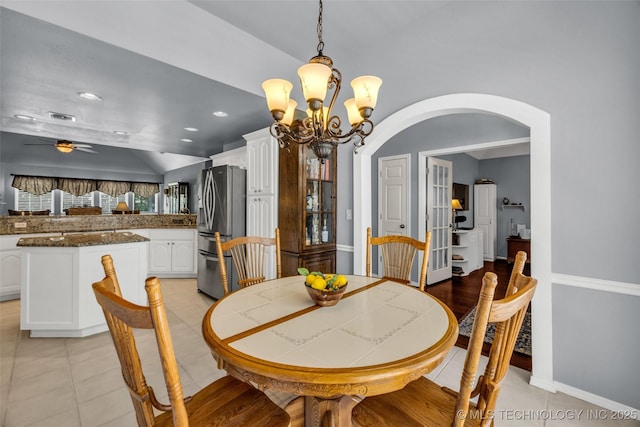 19722 E 50th Ct S, Broken Arrow, OK 74014 - dining area with arched walkways, a chandelier, light tile patterned floors, and ceiling fan
