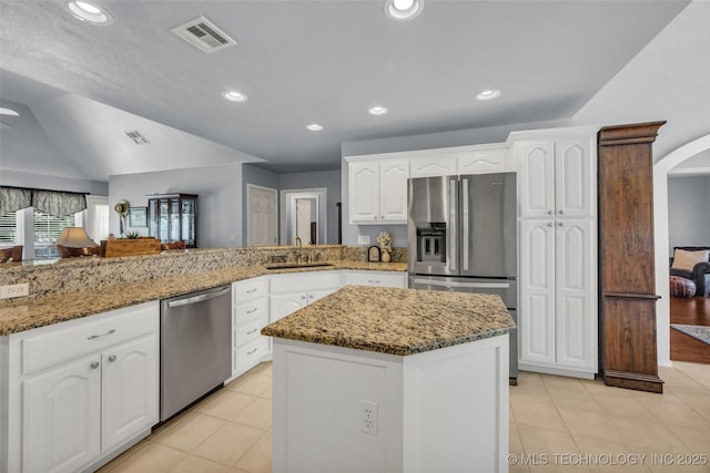 19722 E 50th Ct S, Broken Arrow, OK 74014 - kitchen with appliances with stainless steel finishes, light stone counters, light tile patterned floors, white cabinetry, and recessed lighting