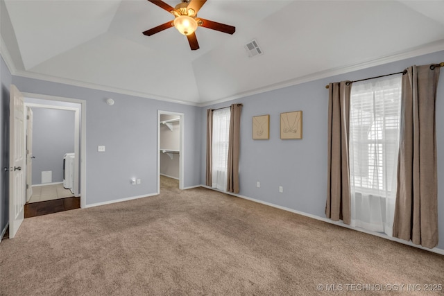 19722 E 50th Ct S, Broken Arrow, OK 74014 - unfurnished bedroom with carpet, lofted ceiling, a walk in closet, washing machine and clothes dryer, and ceiling fan