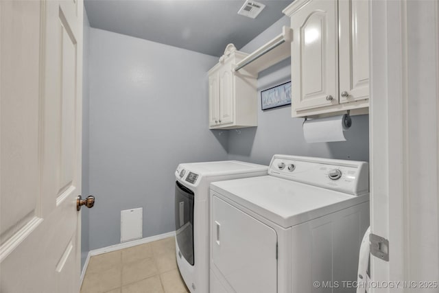 19722 E 50th Ct S, Broken Arrow, OK 74014 - washroom featuring cabinet space, washer and dryer, and light tile patterned floors