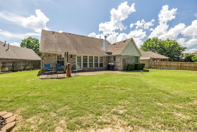 19722 E 50th Ct S, Broken Arrow, OK 74014 - back of house featuring a fenced backyard, a chimney, a patio, and brick siding