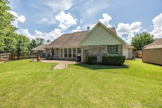 19722 E 50th Ct S, Broken Arrow, OK 74014 - rear view of property featuring a fenced backyard, a patio, and brick siding