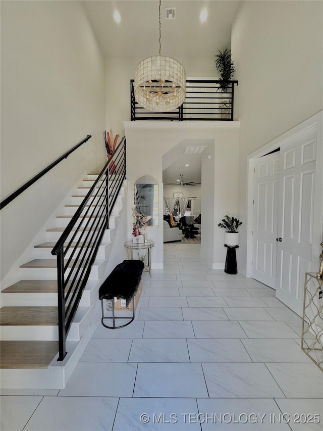 3309 S 116th E Pl, Tulsa, OK 74146 - entrance foyer featuring stairway, a towering ceiling, and recessed lighting