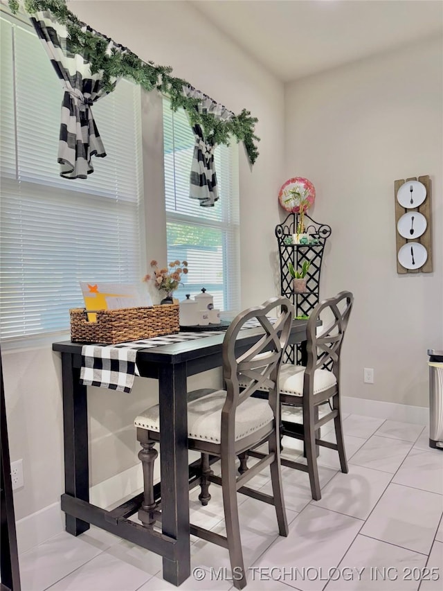 3309 S 116th E Pl, Tulsa, OK 74146 - dining room featuring light tile patterned flooring