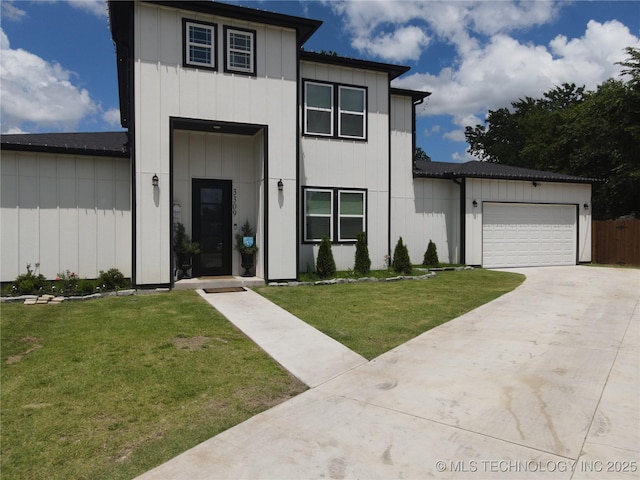 3309 S 116th E Pl, Tulsa, OK 74146 - view of front facade featuring a front yard, a garage, driveway, and board and batten siding
